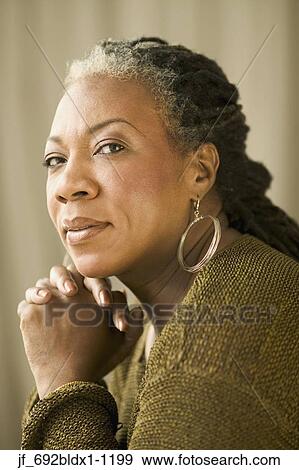 Stock Photo - Woman looking at camera. Fotosearch