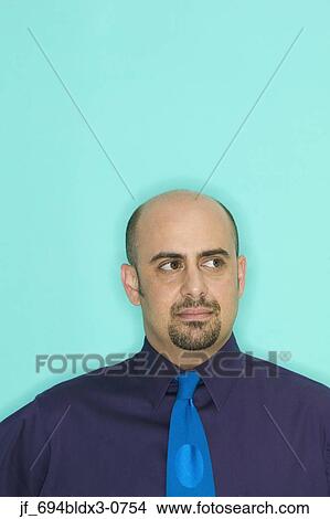 Businessman looking at the side View Large Photo Image Picture - Businessman looking at the side. Fotosearch