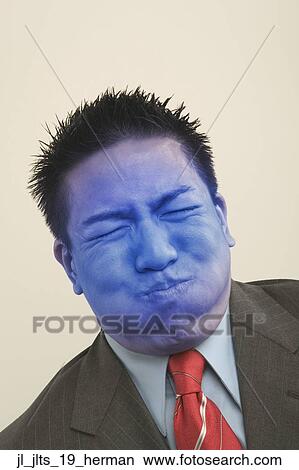 Close-up of a businessman turning blue View Large Photo Image Picture - Close-up of a businessman turning blue. Fotosearch
