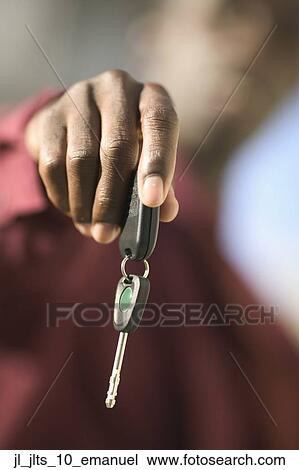 Close-up of a car key in a man's hand View Large Photo Image Stock Image - Close-up of a car key in a man's hand. Fotosearch