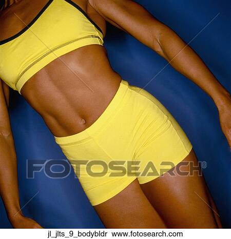 Close-up of the torso of a muscular young woman View Large Photo Image Stock Photography - Close-up of the torso of a muscular young woman. Fotosearch