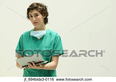 Female doctor writing in a clipboard View Large Photo Image Stock Photograph - Female doctor writing in a clipboard. Fotosearch