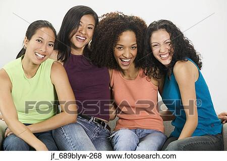 Group of young women looking at camera smiling View Large Photo Image Stock Photo - Group of young women looking at camera smiling. Fotosearch