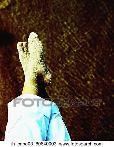 Human feet covered in sand View Large Photo Image Stock Image - Human feet covered in sand. Fotosearch