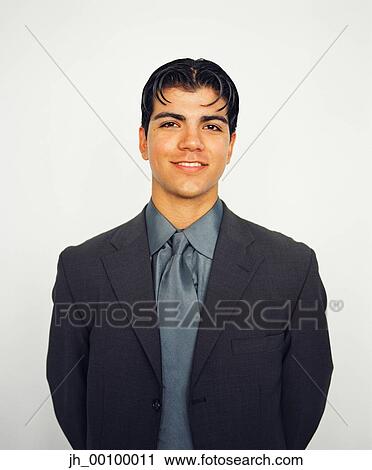 Portrait of a young businessman smiling View Large Photo Image Stock Image - Portrait of a young businessman smiling. Fotosearch