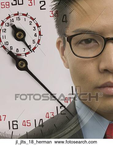 Portrait of a young businessman with a stop watch superimposed View Large Photo Image Picture - Portrait of a young businessman with a stop watch superimposed. Fotosearch