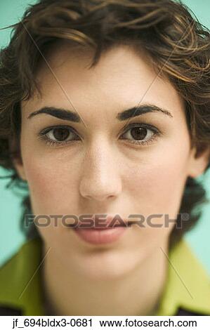 Portrait of a young businesswoman looking at camera smiling View Large Photo Image Stock Image - Portrait of a young businesswoman looking at camera smiling. Fotosearch