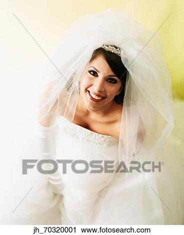 Portrait of a young woman in a bridal gown View Large Photo Image Stock Image - Portrait of a young woman in a bridal gown. Fotosearch