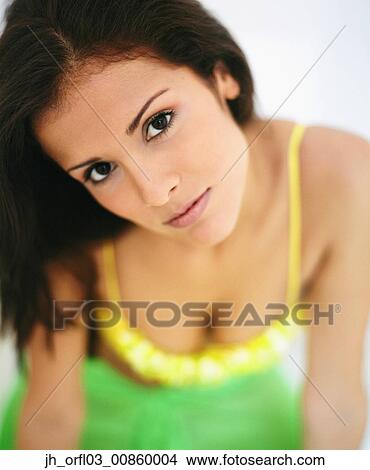 Picture - Portrait of a young woman looking at camera. Fotosearch