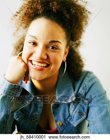 Portrait of a young woman smiling View Large Photo Image Stock Image - Portrait of a young woman smiling. Fotosearch