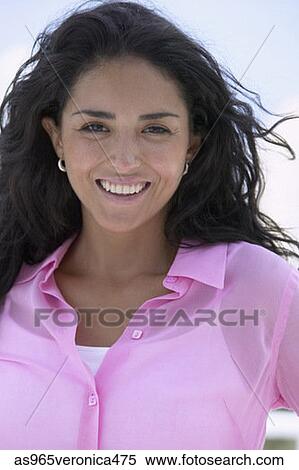 Stock Photography - Portrait of a young woman smiling. Fotosearch
