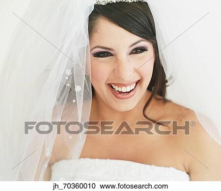 Portrait of a young woman wearing bridal outfit View Large Photo Image Stock Image - Portrait of a young woman wearing bridal outfit. Fotosearch