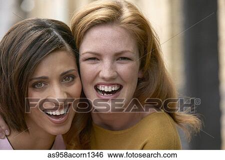 Portrait of two women smiling View Large Photo Image Stock Photograph - Portrait of two women smiling. Fotosearch