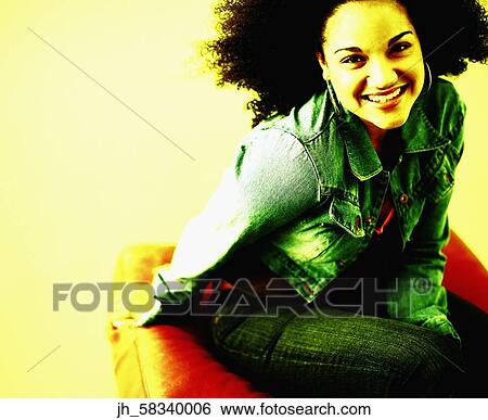 Stock Photograph - Portrait of young woman smiling. Fotosearch