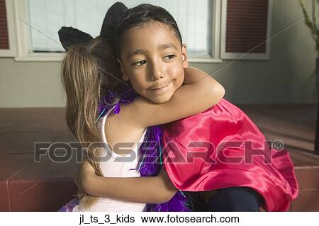 Side profile of a young boy and girl embracing View Large Photo Image Stock Photograph - Side profile of a young boy and girl embracing. Fotosearch