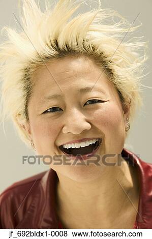Woman looking at camera laughing View Large Photo Image Stock Photo - Woman looking at camera laughing. Fotosearch