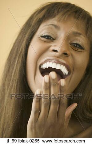 Woman looking at camera smiling View Large Photo Image Stock Photography - Woman looking at camera smiling. Fotosearch
