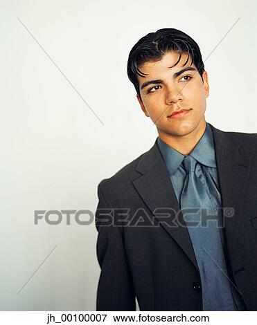 Stock Photo - Young businessman looking ahead. Fotosearch