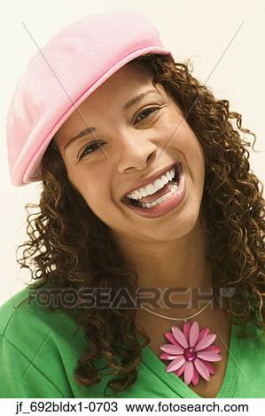 Young woman looking at camera smiling View Large Photo Image Stock Image - Young woman looking at camera smiling. Fotosearch