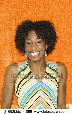 Young woman looking at camera smiling View Large Photo Image Stock Photo - Young woman looking at camera smiling. Fotosearch