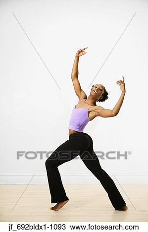 Stock Image - Young woman performing ballet. Fotosearch