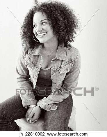 Stock Image - Young woman smiling. Fotosearch