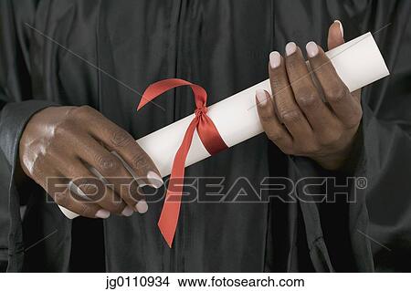 Female graduate holding diploma View Large Photo Image Picture - Female graduate holding diploma. Fotosearch