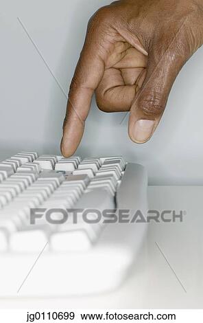 Human hand operating a computer keyboard, View Large Photo Image Stock Photo - Human hand operating a computer keyboard,. Fotosearch