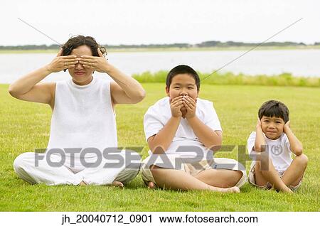 Mid adult woman and two young boys signing hear no evil, see no evil, speak no evil, View Large Photo Image Stock Image - Mid adult woman and two young boys signing hear no evil, see no evil, speak no evil,. Fotosearch