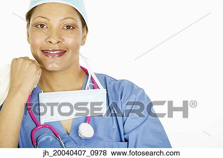 Portrait of a female doctor smiling View Large Photo Image Stock Photo - Portrait of a female doctor smiling. Fotosearch