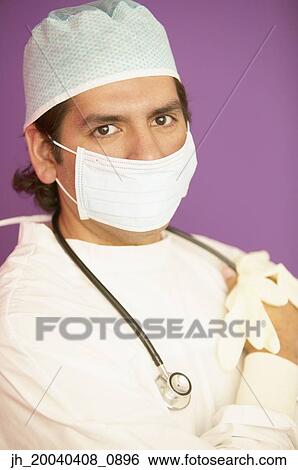 Portrait of a male doctor in full scrubs View Large Photo Image Stock Photograph - Portrait of a male doctor in full scrubs. Fotosearch