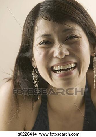 Portrait of a woman smiling looking at camera View Large Photo Image Picture - Portrait of a woman smiling looking at camera. Fotosearch