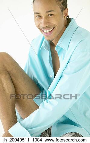 Portrait of a young man smiling View Large Photo Image Picture - Portrait of a young man smiling. Fotosearch