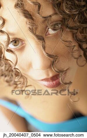 Picture - Portrait of a young woman looking up. Fotosearch