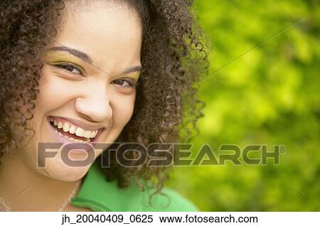 Portrait of a young woman smiling View Large Photo Image Stock Photography - Portrait of a young woman smiling. Fotosearch