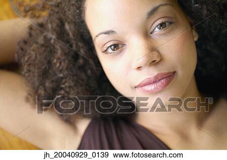 Portrait of a young woman View Large Photo Image Stock Photo - Portrait of a young woman. Fotosearch