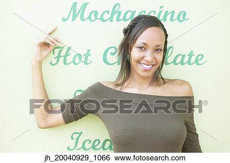 Portrait of young woman smiling View Large Photo Image Stock Photograph - Portrait of young woman smiling. Fotosearch