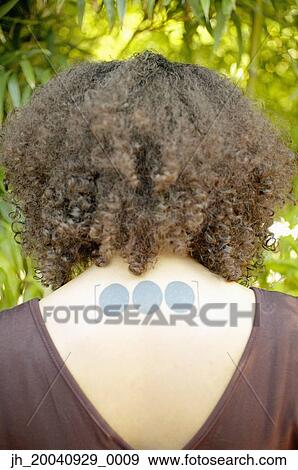 Rear view of a young woman View Large Photo Image Stock Photo - Rear view of a young woman. Fotosearch