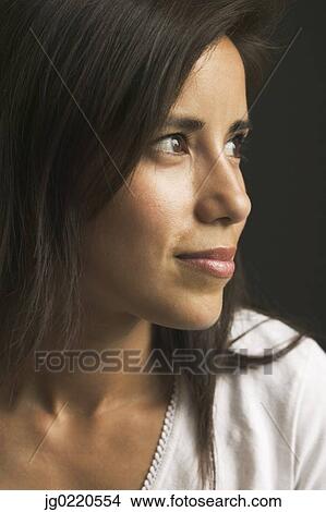 Picture - Woman looking at the side. Fotosearch