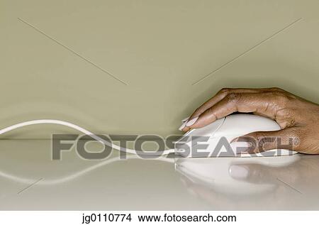 Woman's hand operating a computer mouse View Large Photo Image Picture - Woman's hand operating a computer mouse. Fotosearch