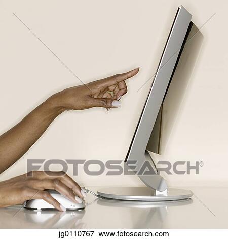 Woman's hands using a computer mouse and pointing at a screen View Large Photo Image Stock Photo - Woman's hands using a computer mouse and pointing at a screen. Fotosearch