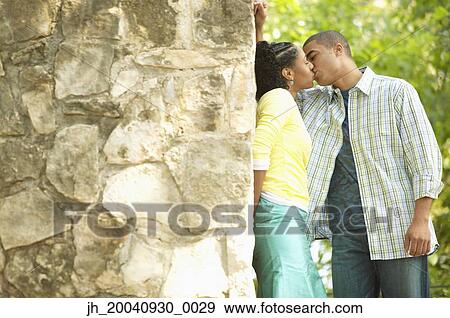 Young couple kissing View Large Photo Image Stock Photo - Young couple kissing. Fotosearch