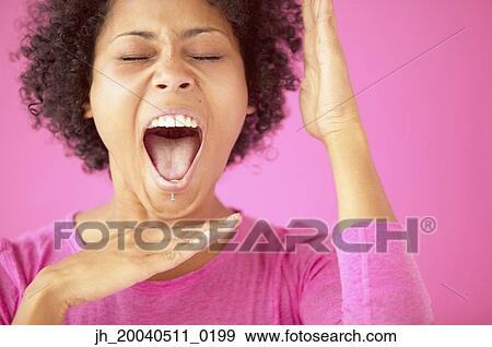 Stock Photo - Young woman shouting. Fotosearch
