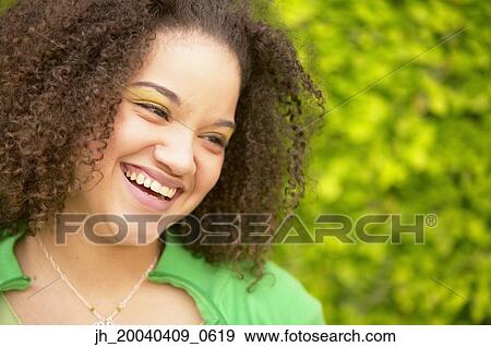 Young woman smiling View Large Photo Image Stock Photo - Young woman smiling. Fotosearch