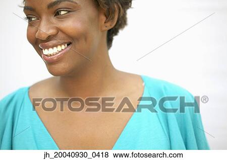 Stock Photo - Young woman smiling. Fotosearch
