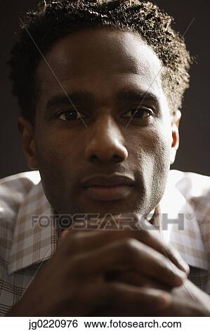 Stock Photograph - Close-up of a mid adult man. Fotosearch
