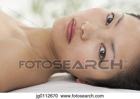 Stock Image - Close-up of a mid adult woman. Fotosearch