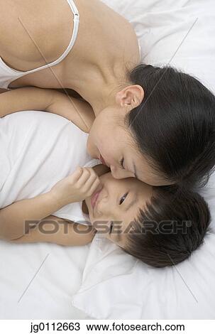 Stock Image - High angle view of a mother with her son. Fotosearch