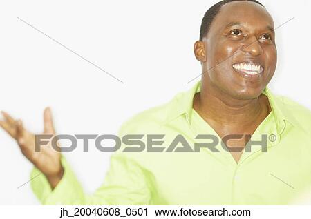 Mid adult man smiling looking up View Large Photo Image Stock Image - Mid adult man smiling looking up. Fotosearch