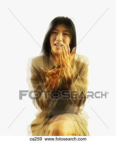 Stock Photo - Portrait of a businesswoman sitting. Fotosearch